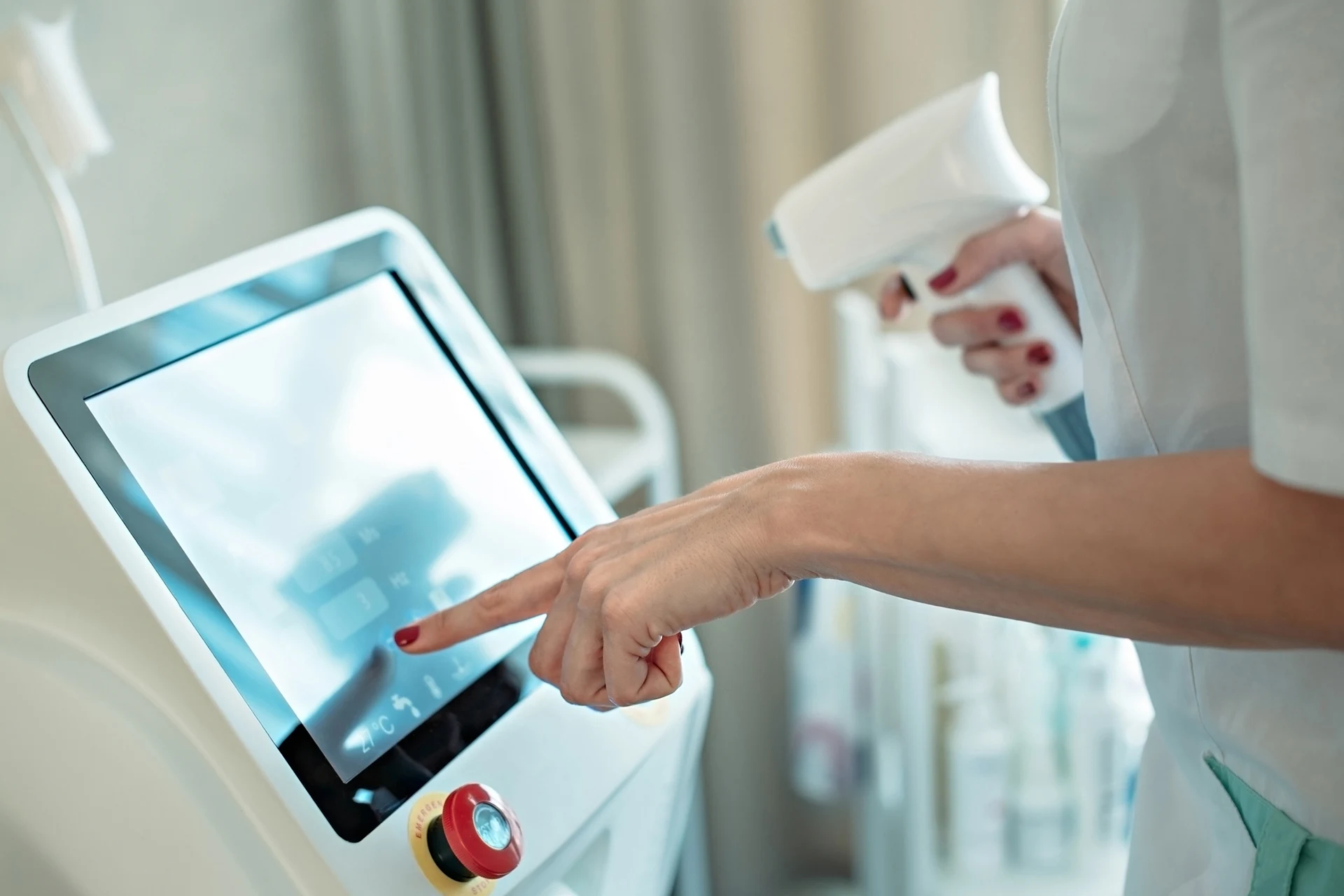 Professional using a touchscreen interface on an IoT-enabled medical machine