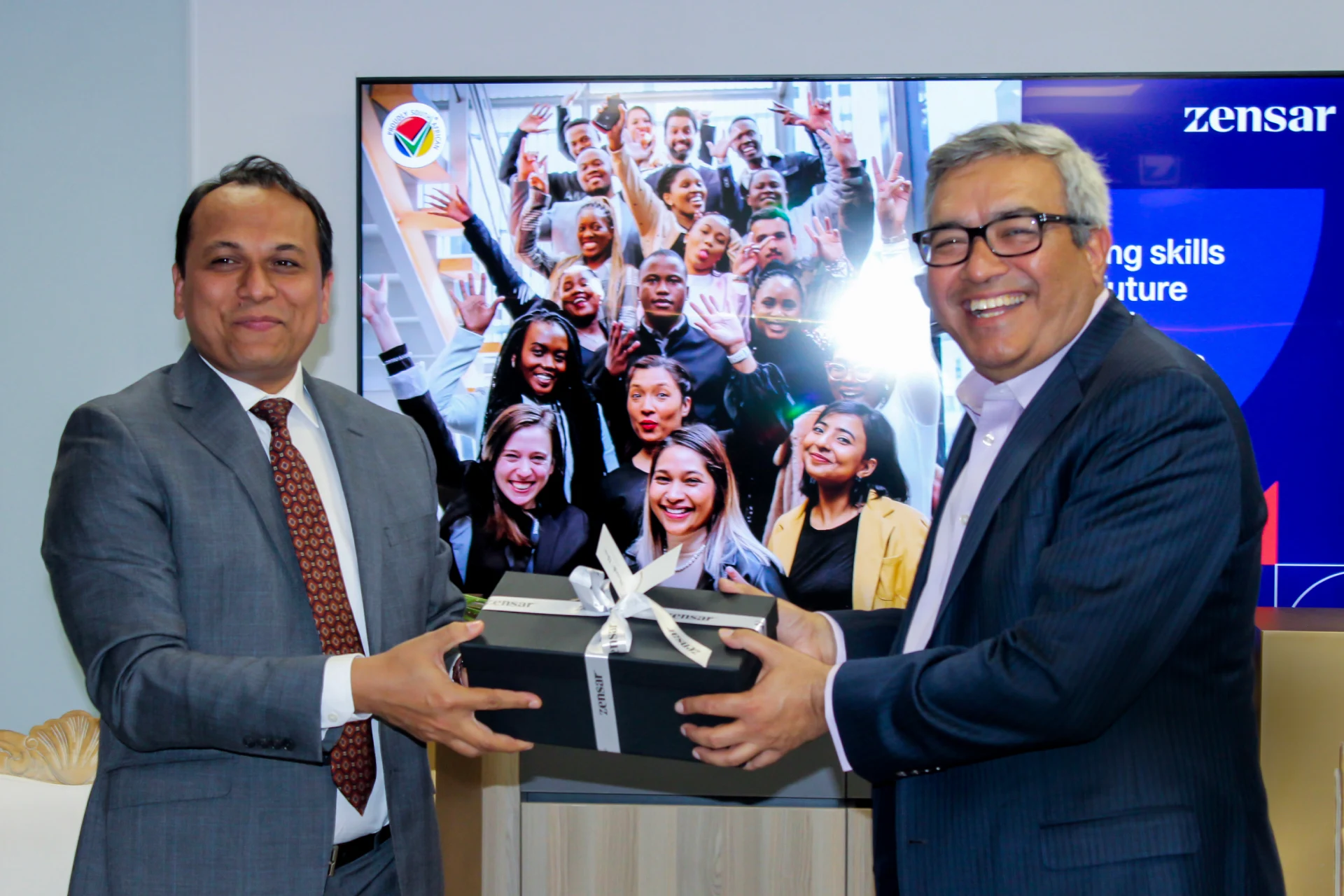 Gift exchange celebrating the milestone 1000th intern in South Africa program