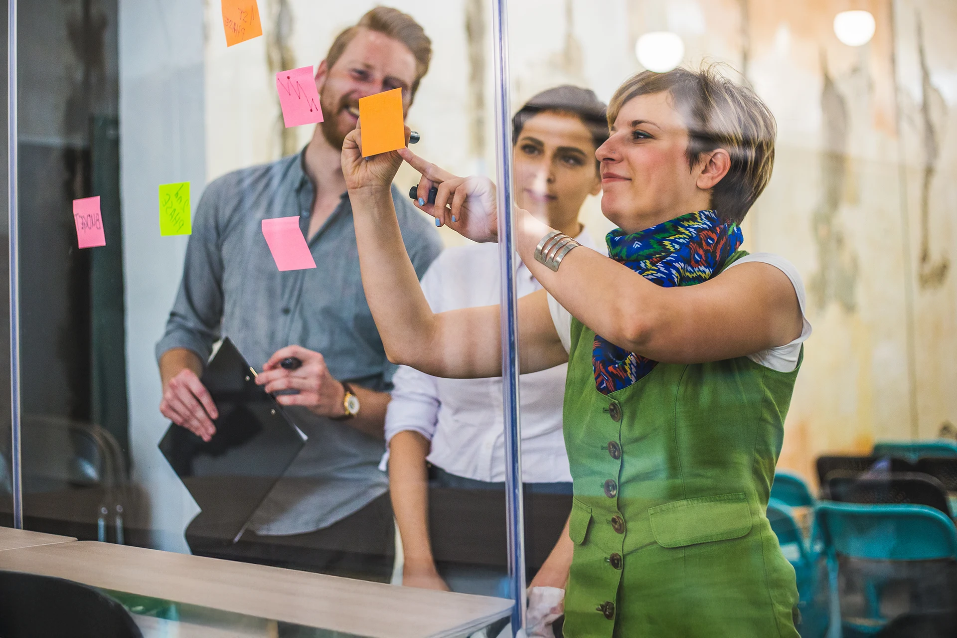 Team collaborating with sticky notes for agile planning and strategy.