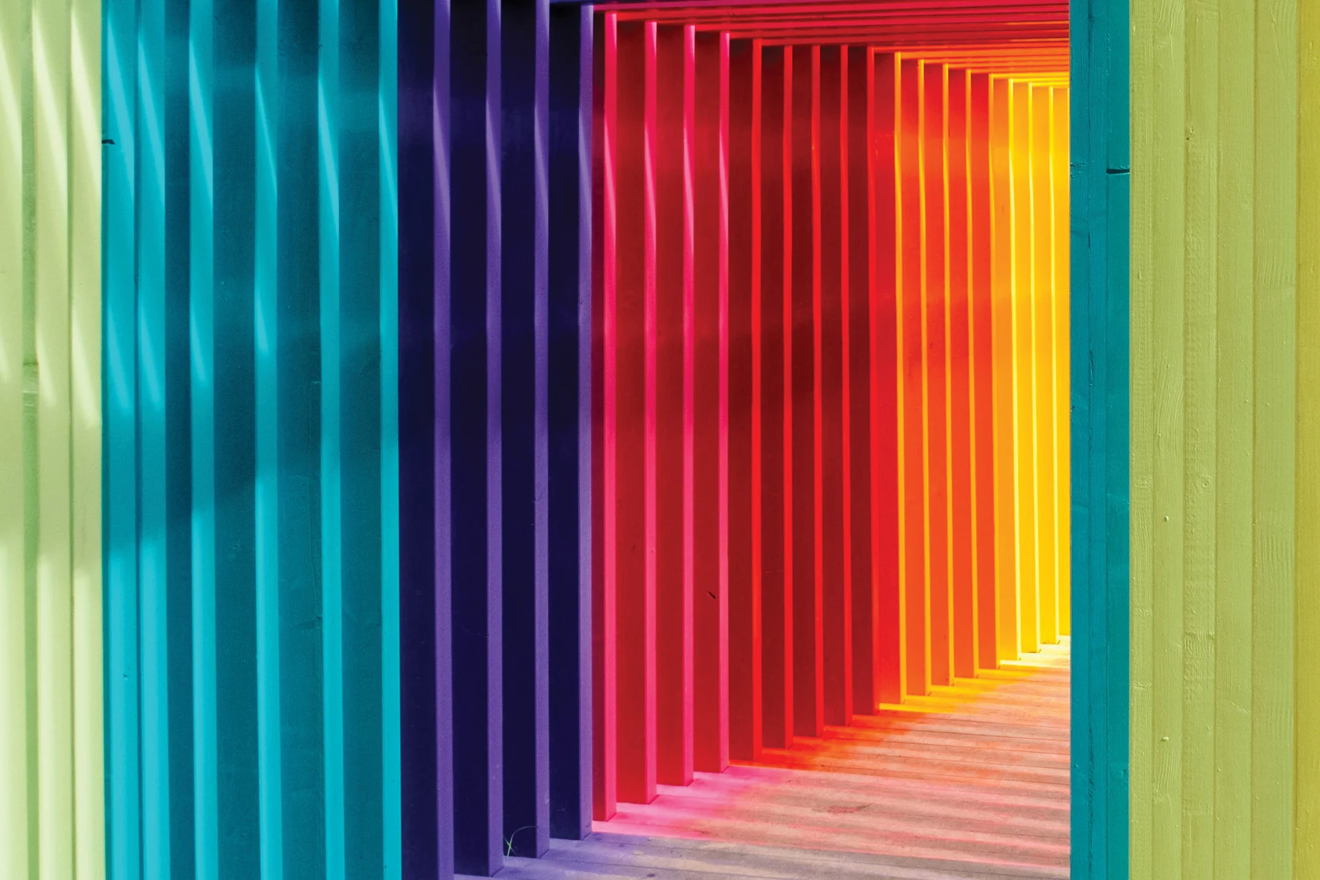Colorful vertical slats hallway for Foolproof digital customer experiences