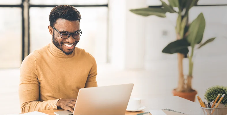 Professional working on laptop for Infinity Circle wealth management platform