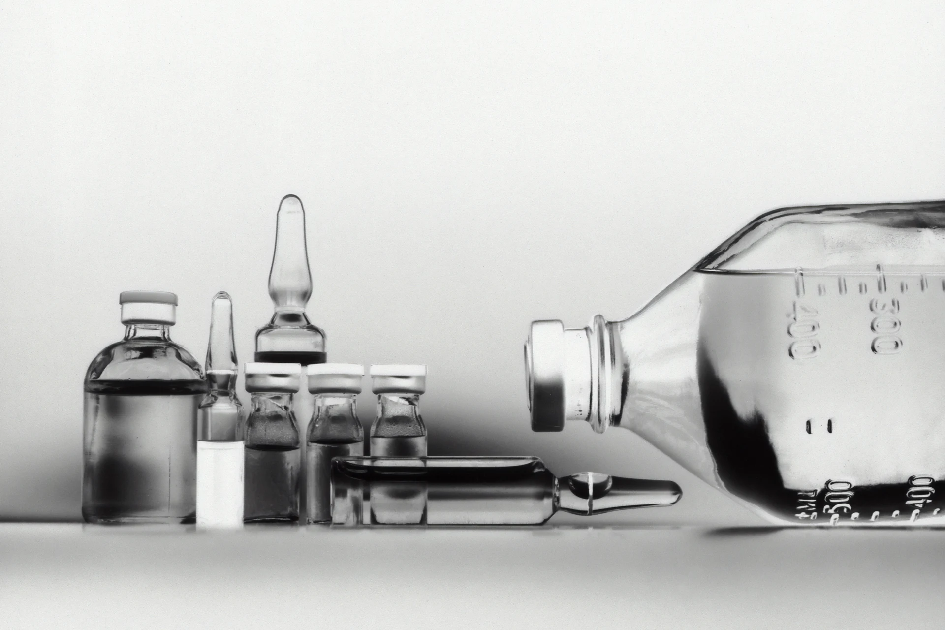 Glass vials and bottles used for pharmaceutical applications.