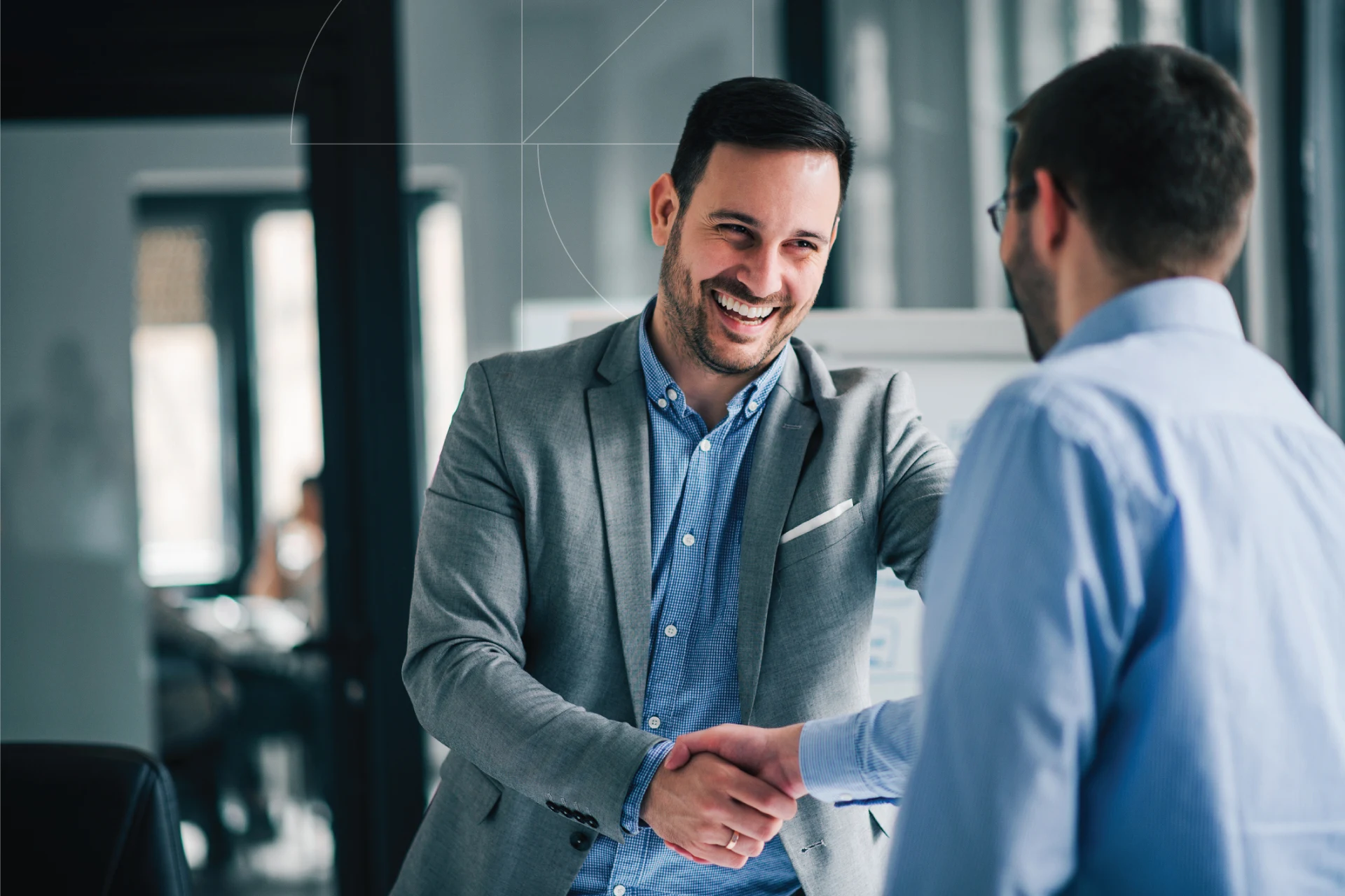 Professionals handshake for Zensar Guidewire services extension to EMEA region