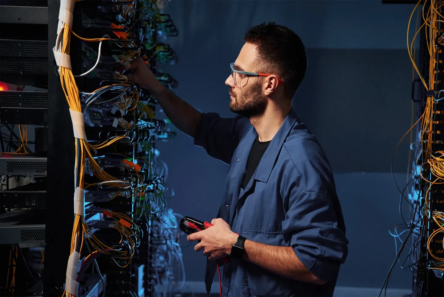 Technician working on server equipment for automated invoice processing