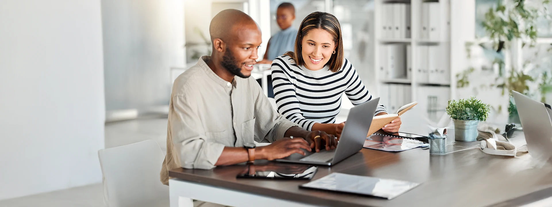Business professionals engaging in strategic tech marketing conversation