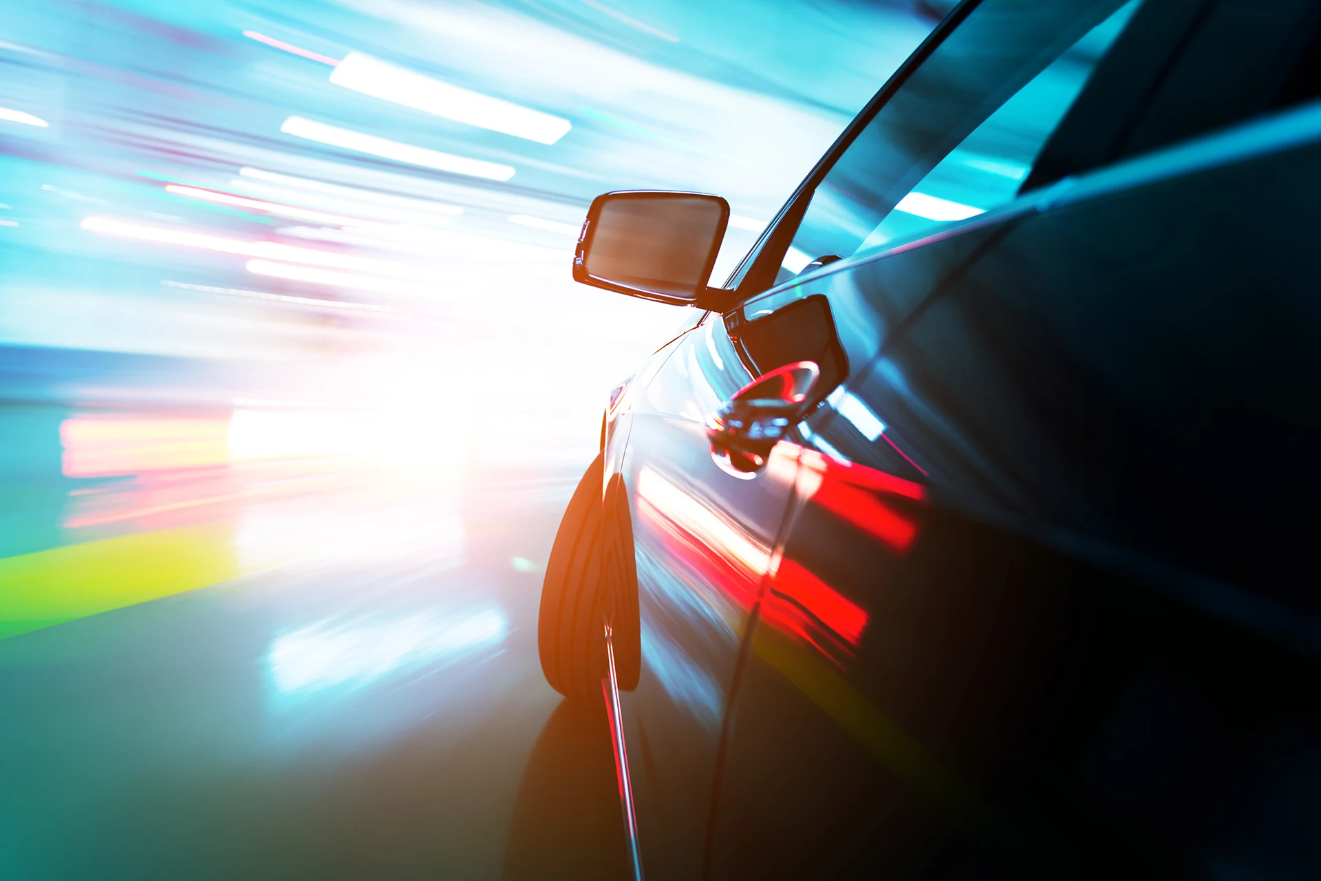 Side view of a car in motion, illustrating automotive industry themes