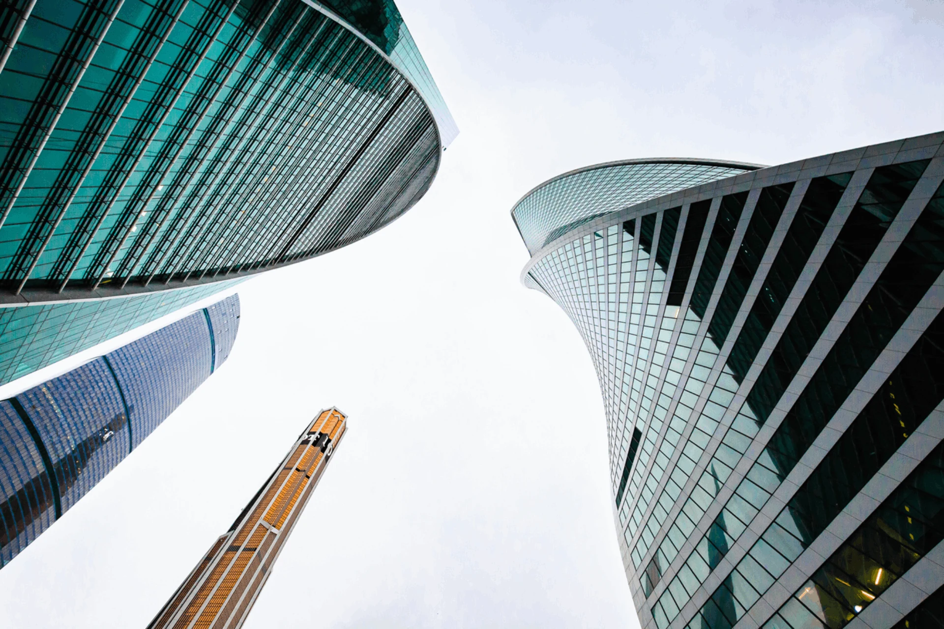View of modern skyscrapers from below emphasizing innovative architecture