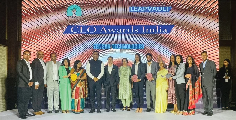 Zensar team posing with four trophies at TISS LeapVault CLO Awards India