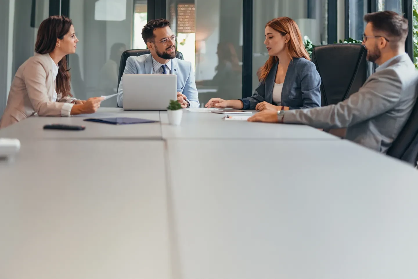 Team meeting in a conference room discussing digital transformation strategy