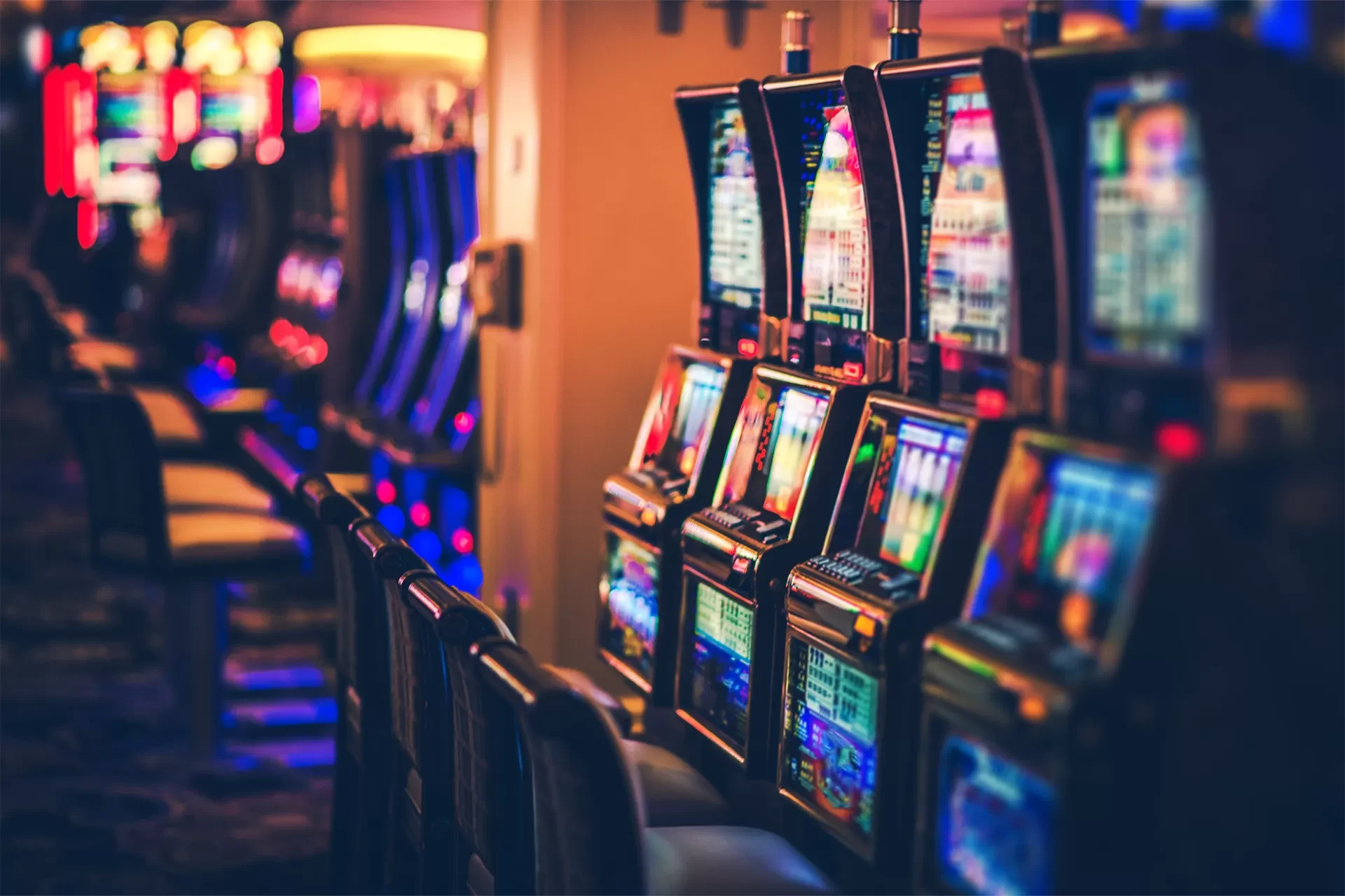 Row of slot machines in an iGaming environment at a casino