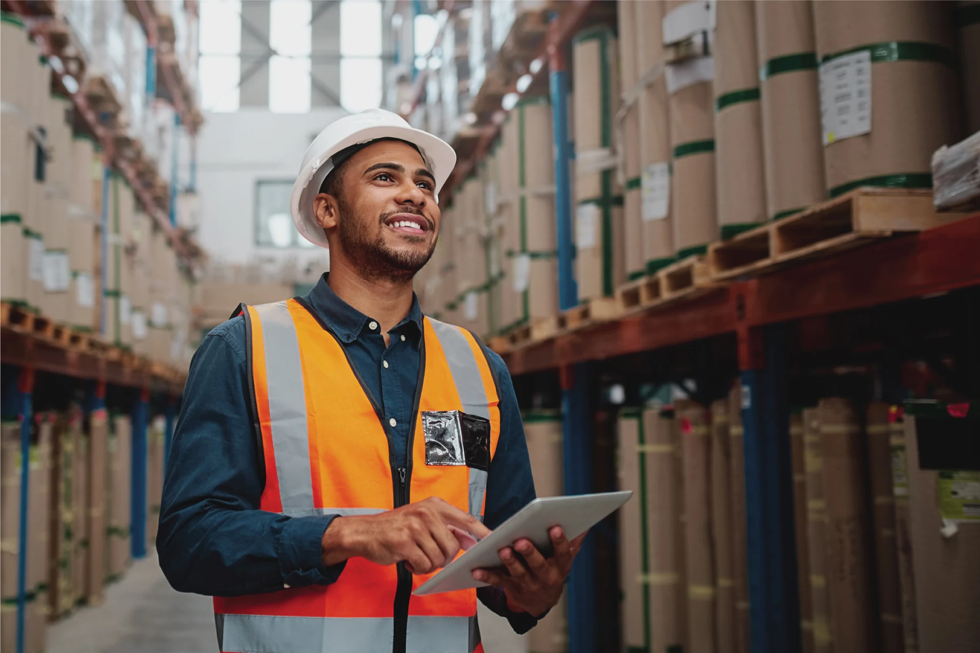 Warehouse worker using a tablet in a supply chain environment