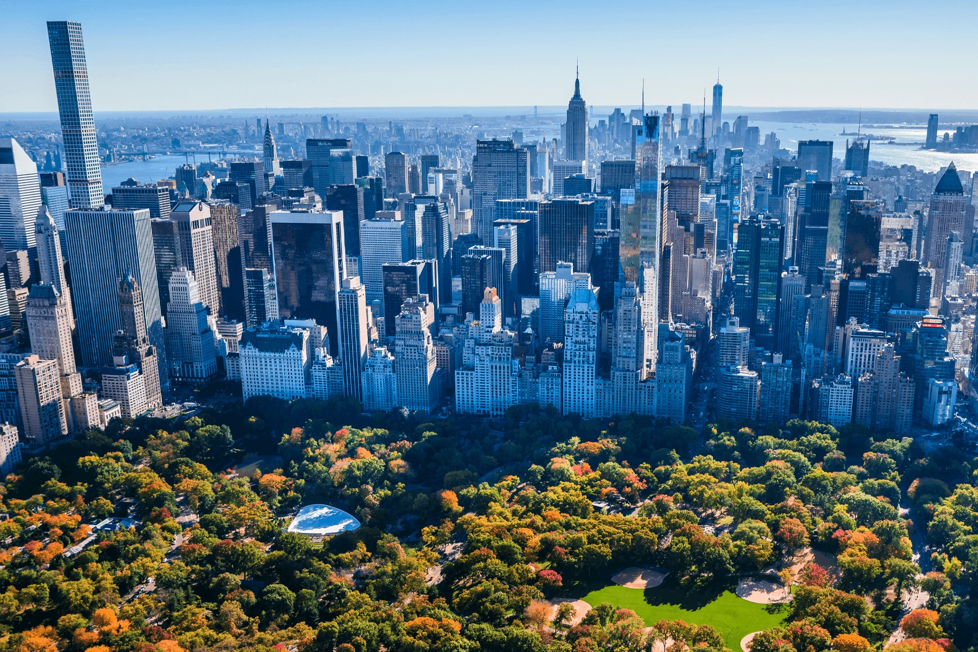 Aerial view of a large city skyline, emphasizing urban infrastructure and