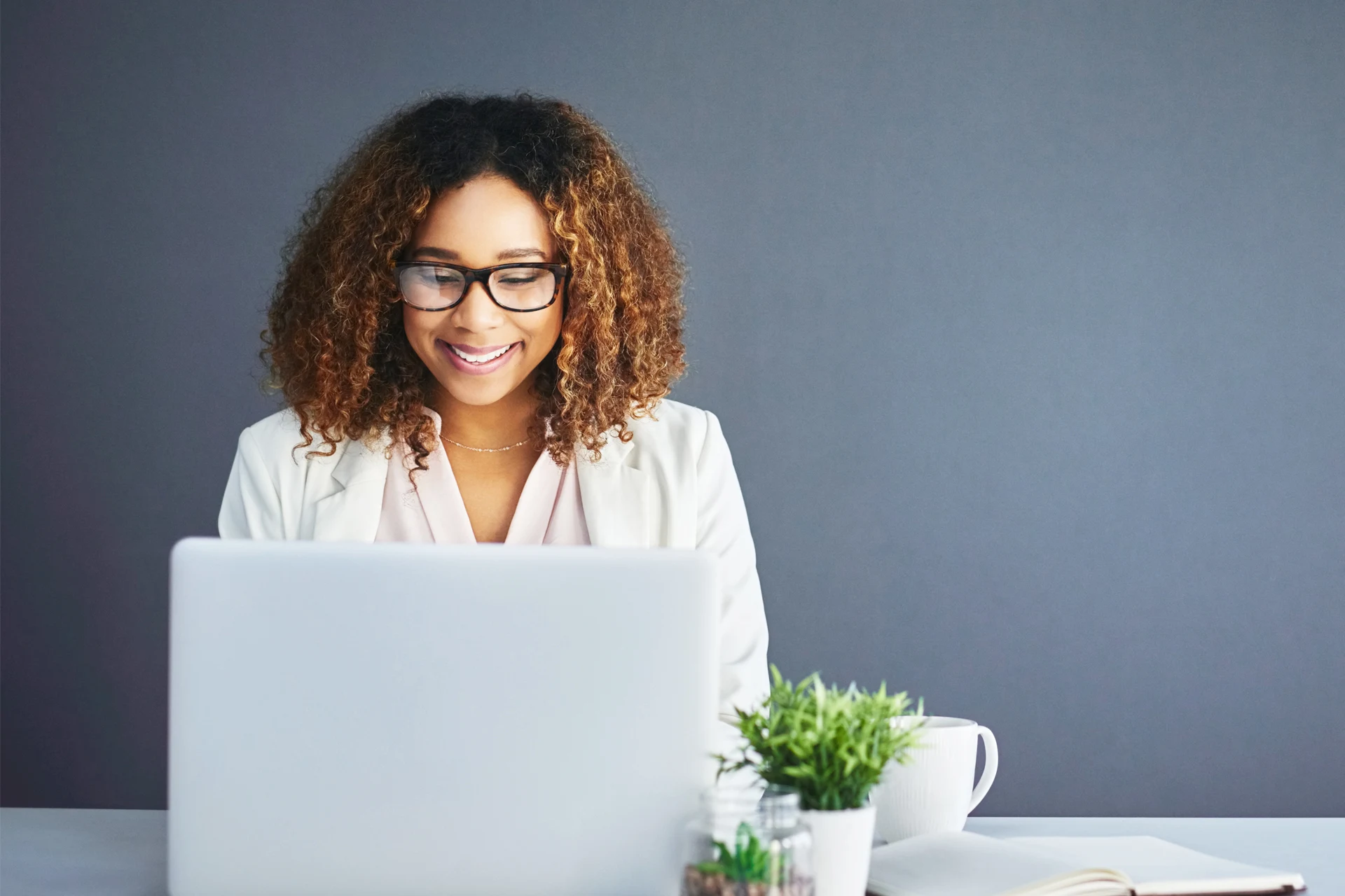 Professional working on laptop to enhance workforce planning efficiency