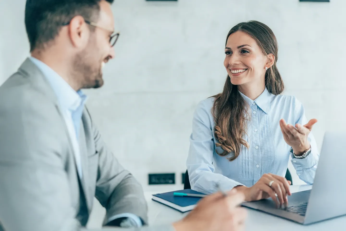 Professional discussing modernized treasury applications in a meeting.