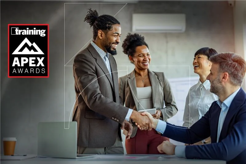 Business handshake celebrating Zensar 2025 Training APEX Awards victory