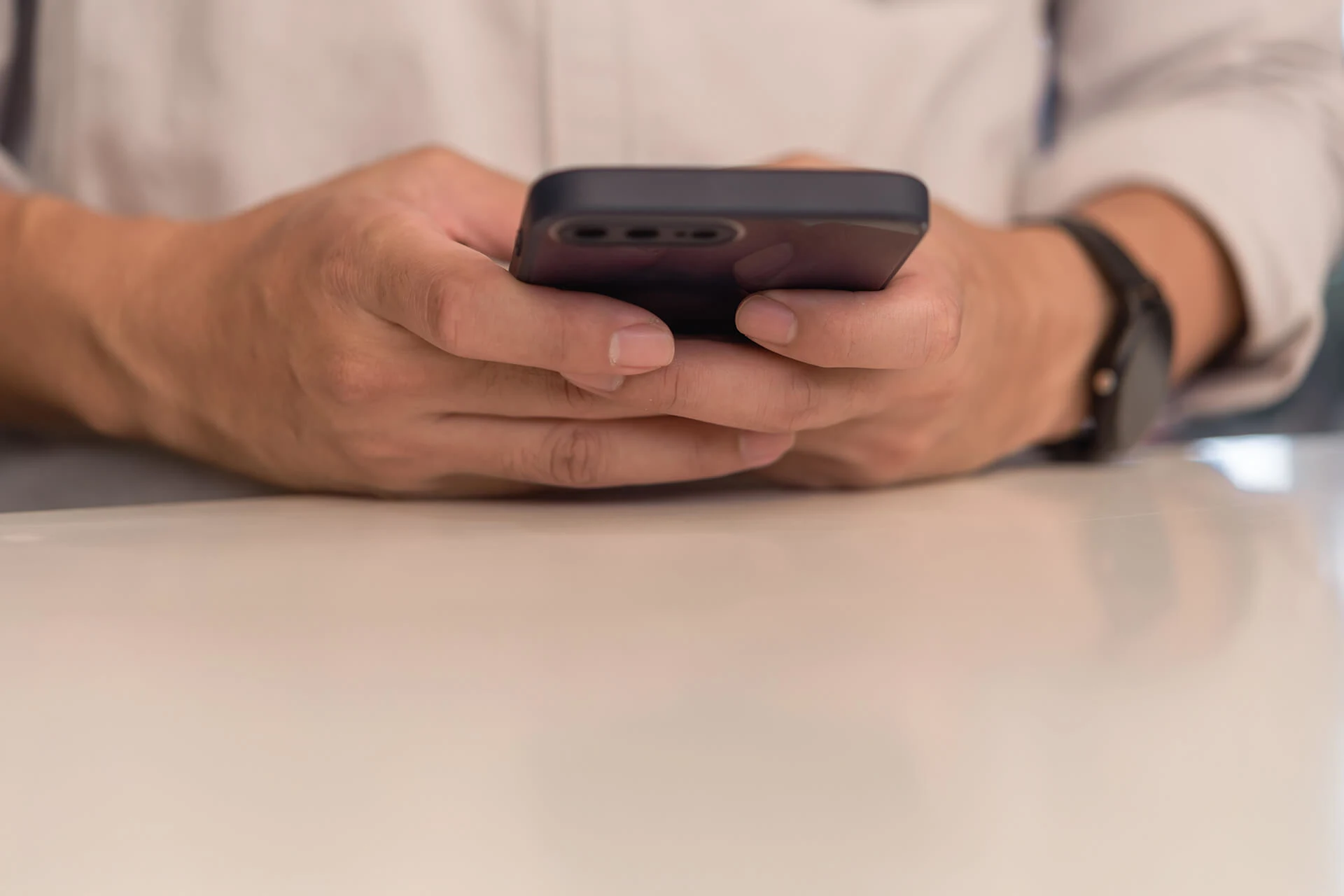 Person using a smartphone, relevant to SSL pinning in Android apps