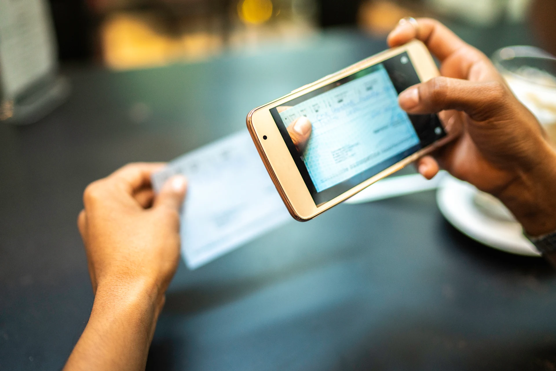 Person capturing an image of a utility bill with a smartphone