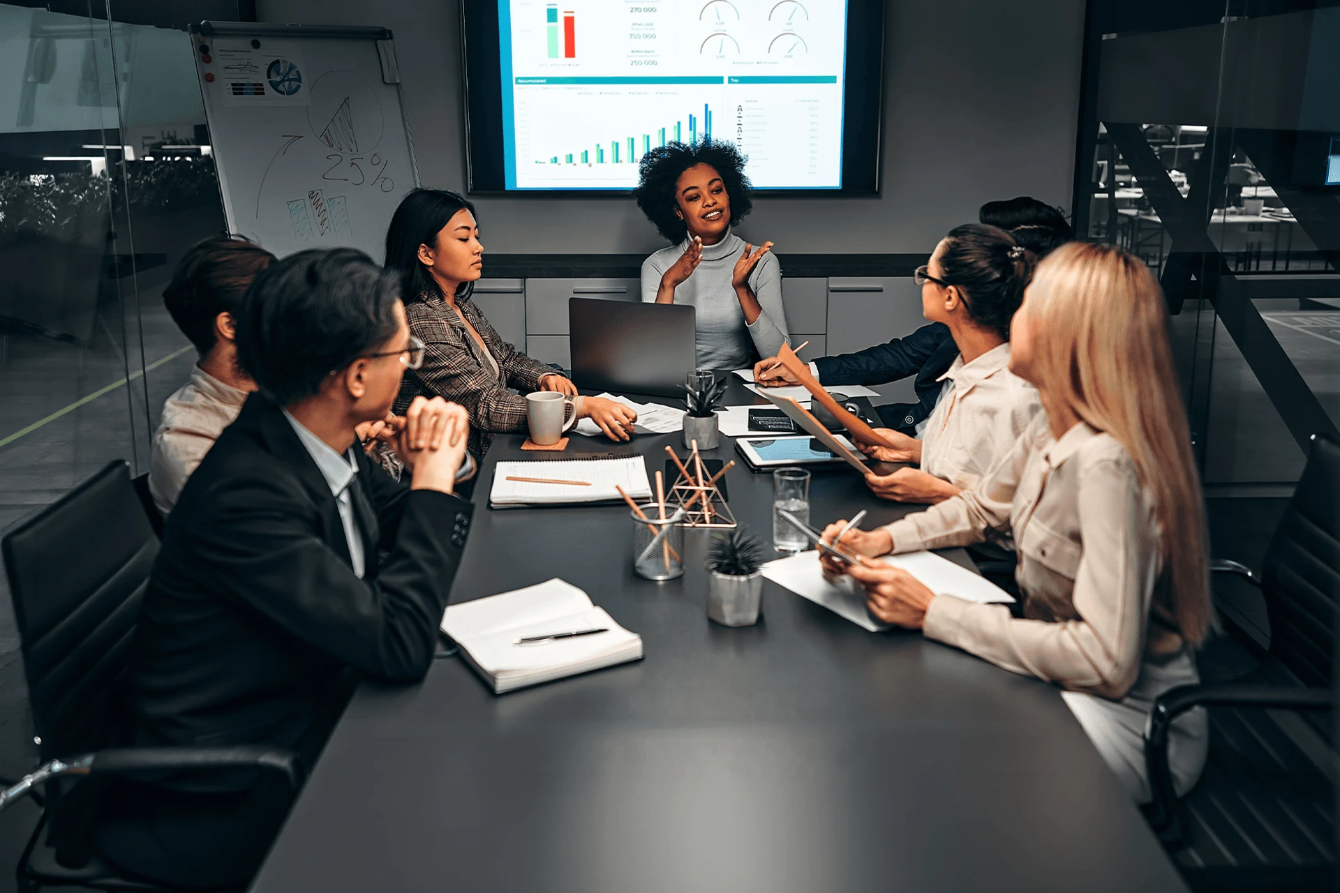 Team collaborating in a meeting to discuss Guidewire analytics strategies