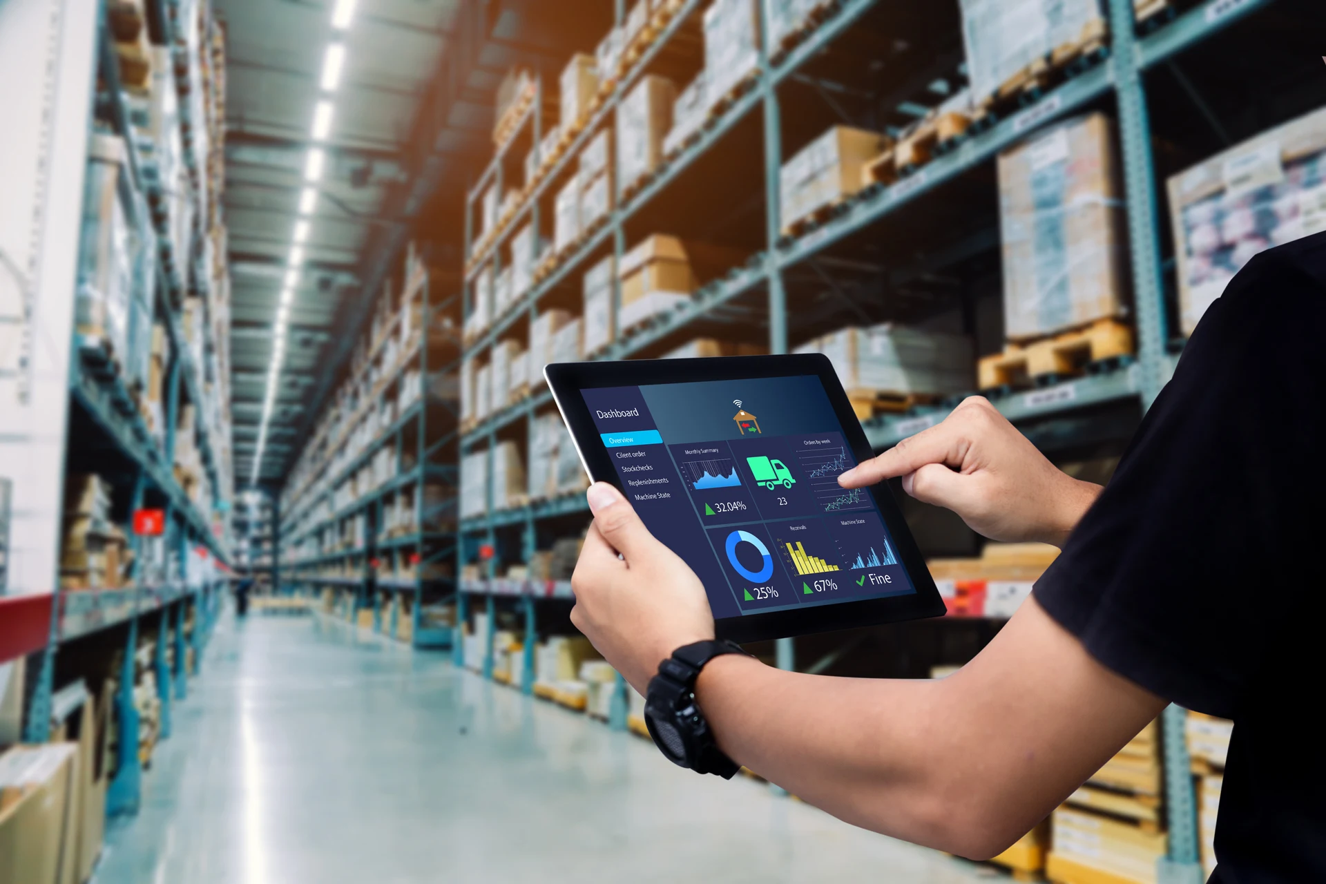 Person accessing a digital dashboard in a warehouse for supply chain