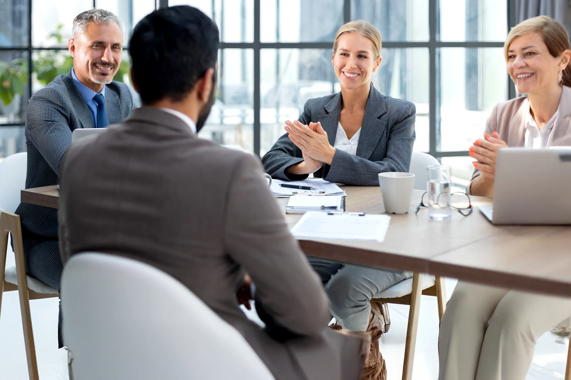 Business meeting with professionals discussing GTM strategies for lending
