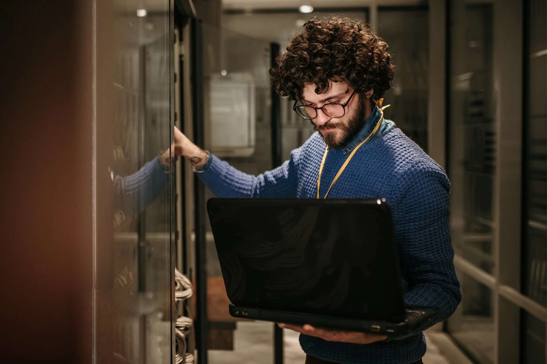 Professional reviewing systems while holding a laptop in a service area