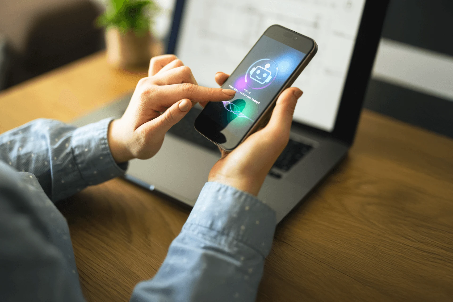 Person using a smartphone interface with a chatbot on a wooden desk