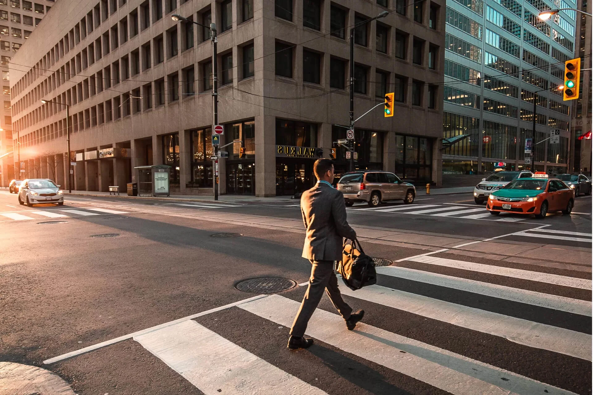 Business professional crossing the street in an urban setting