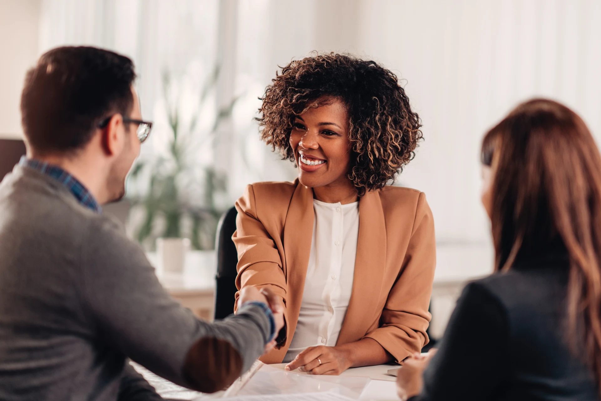 Professionals handshake at meeting for Top Employer 2024 South Africa