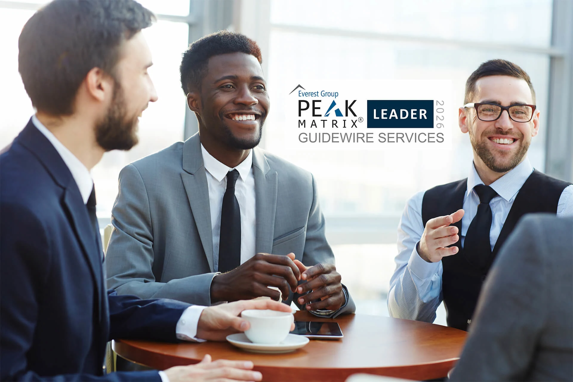 Professionals discussing Zensar's recognition as a Leader in Guidewire