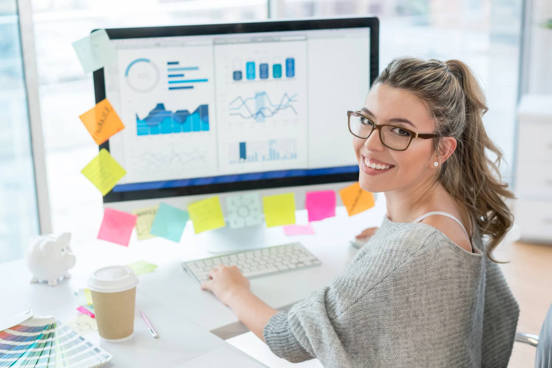 Professional analyzing data with charts on a computer at Zensar