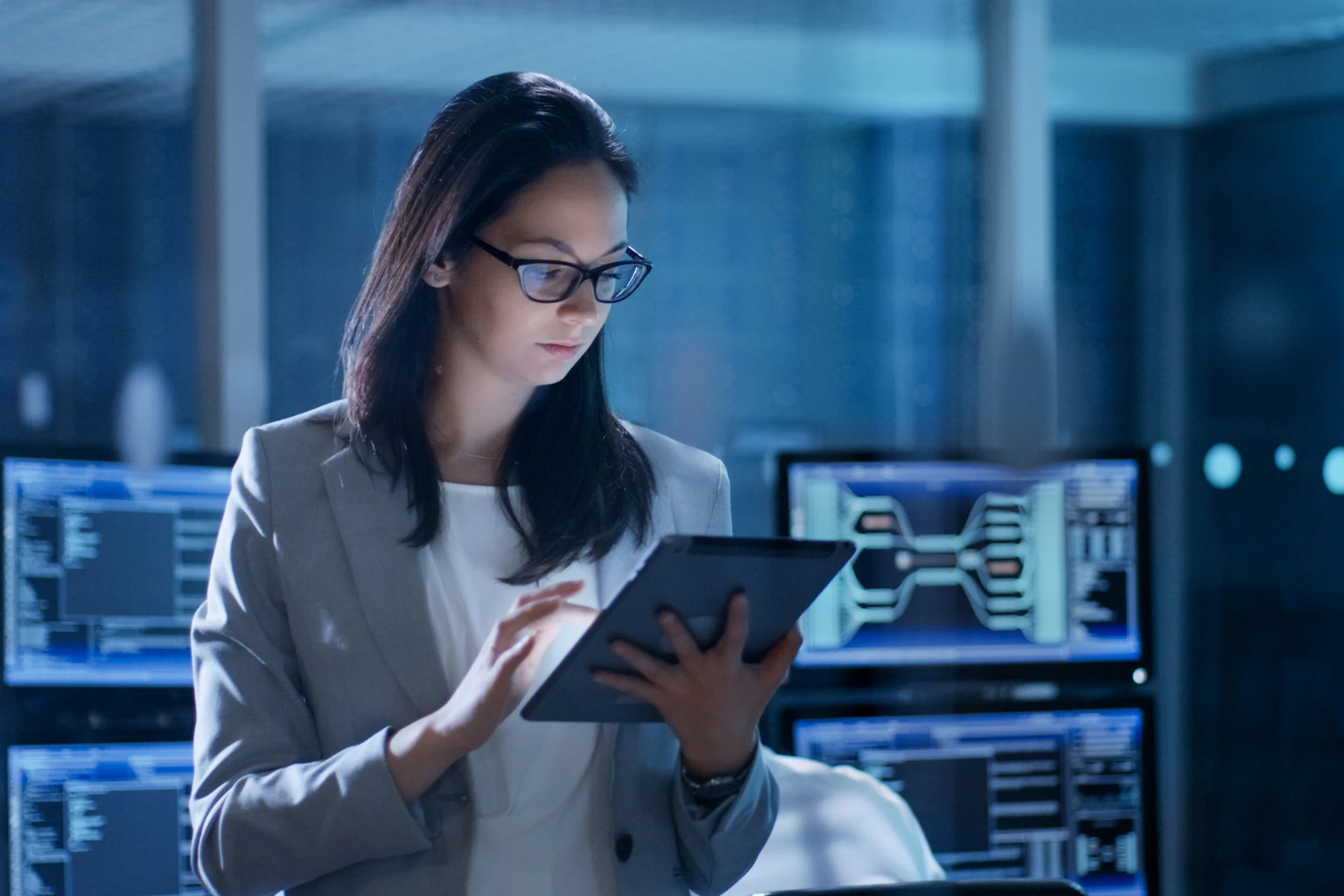 Professional reviewing data on a tablet in a digital security environment