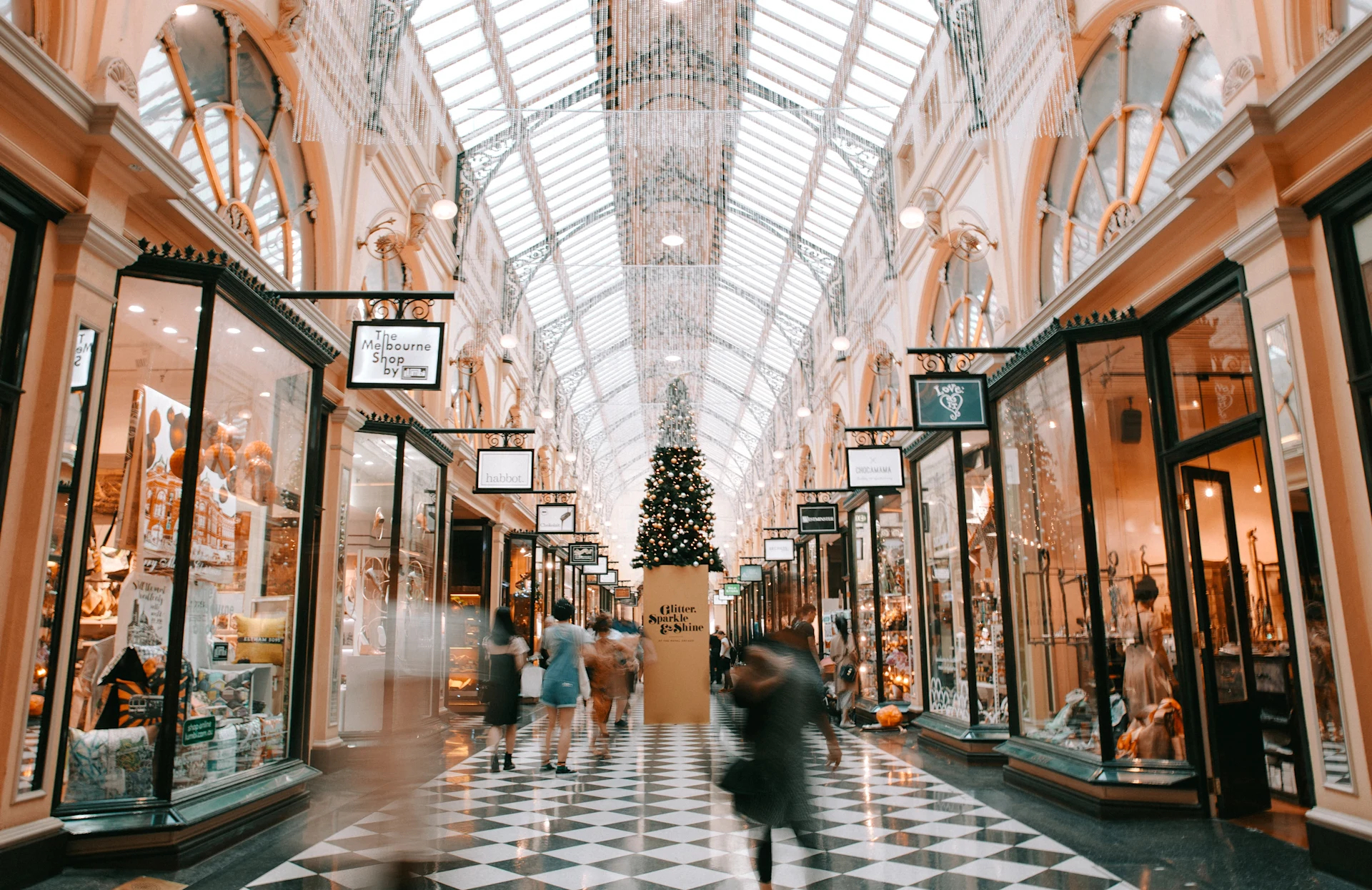 Interior of a shopping arcade decorated for the holiday season.