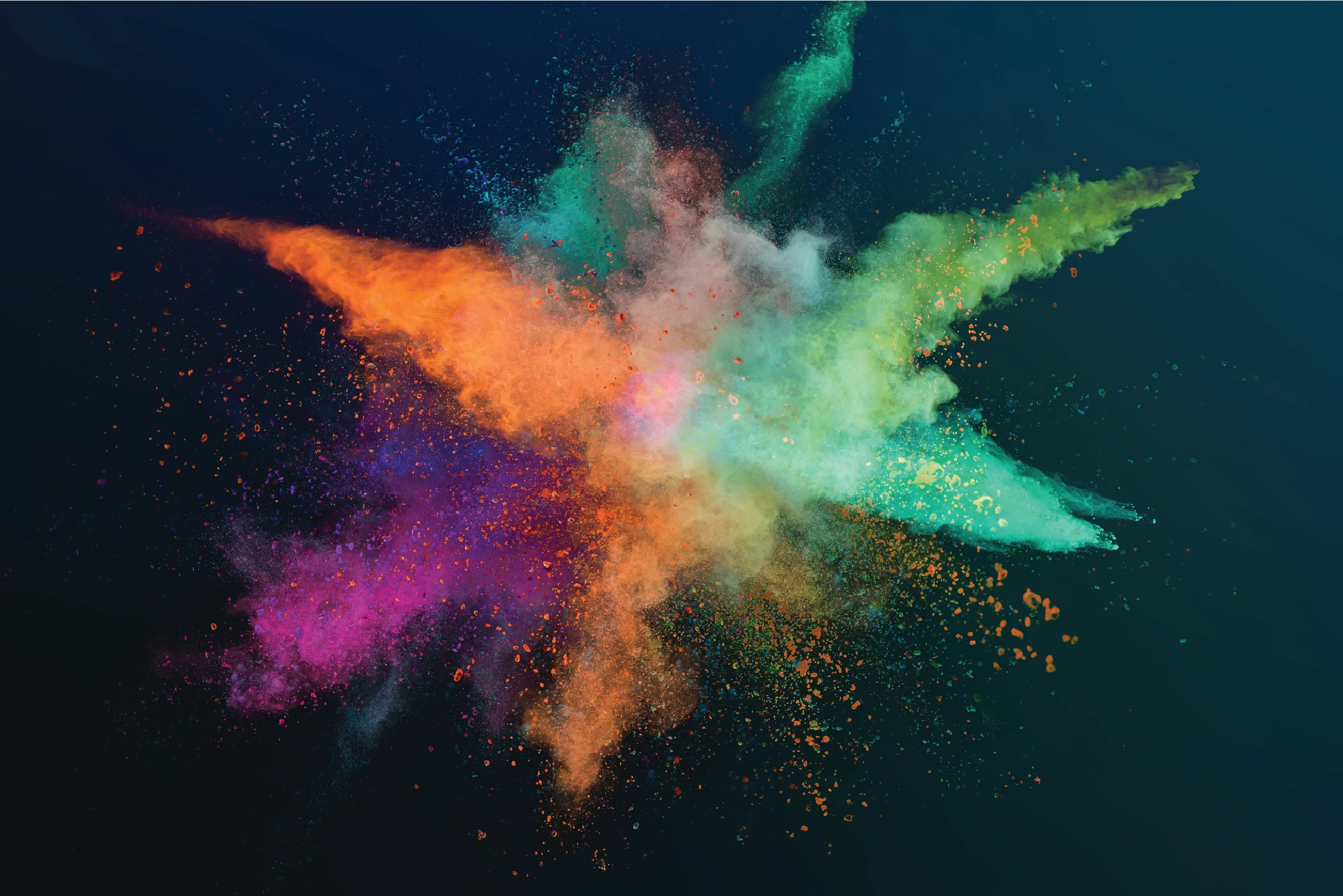 Colorful powder explosion suggesting creativity and a diverse global tech workforce.