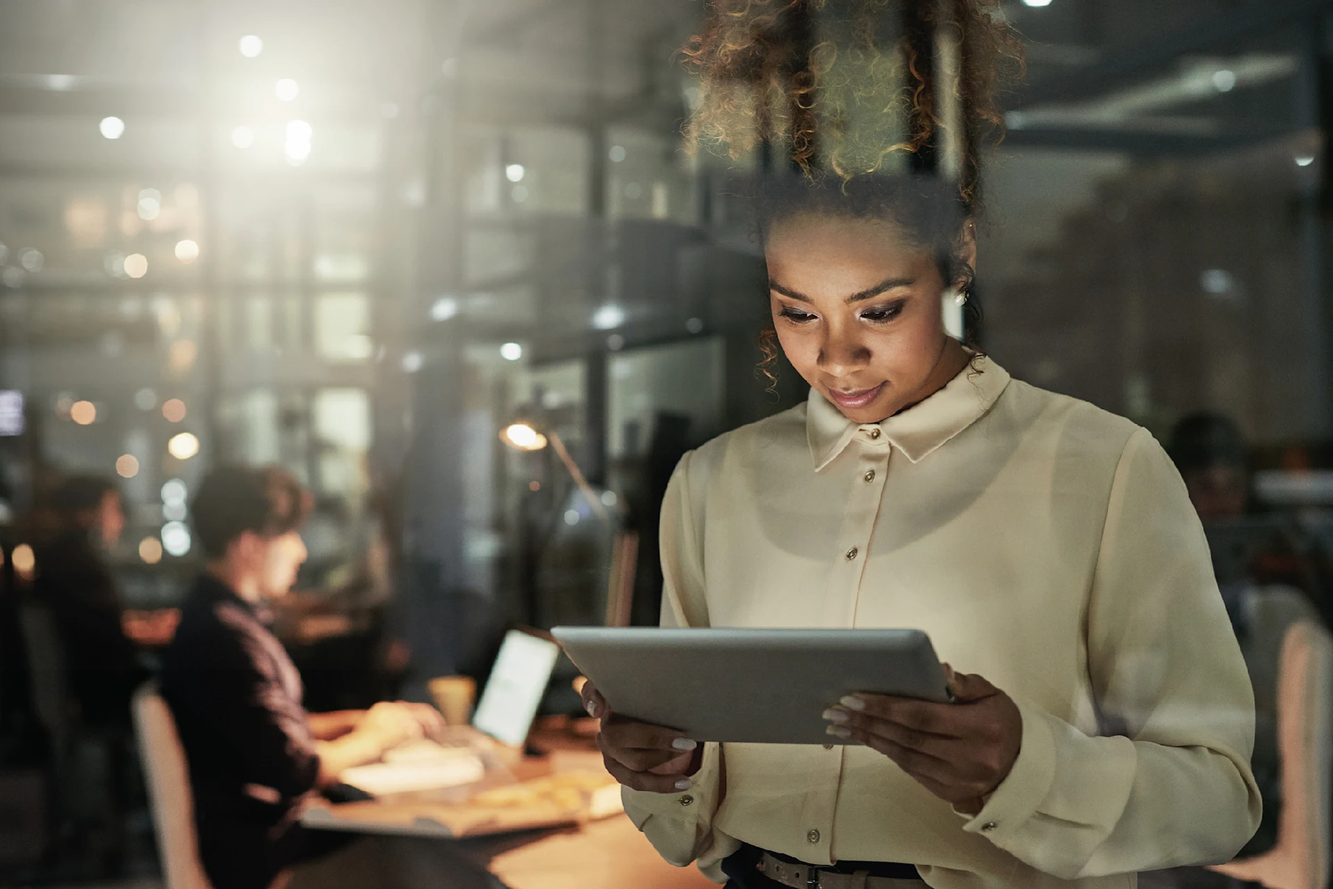 Professional using tablet for digital interactive experience IX services