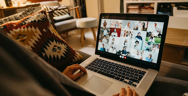 Person using laptop to attend Indigo Slate Everywhere Experiences video call