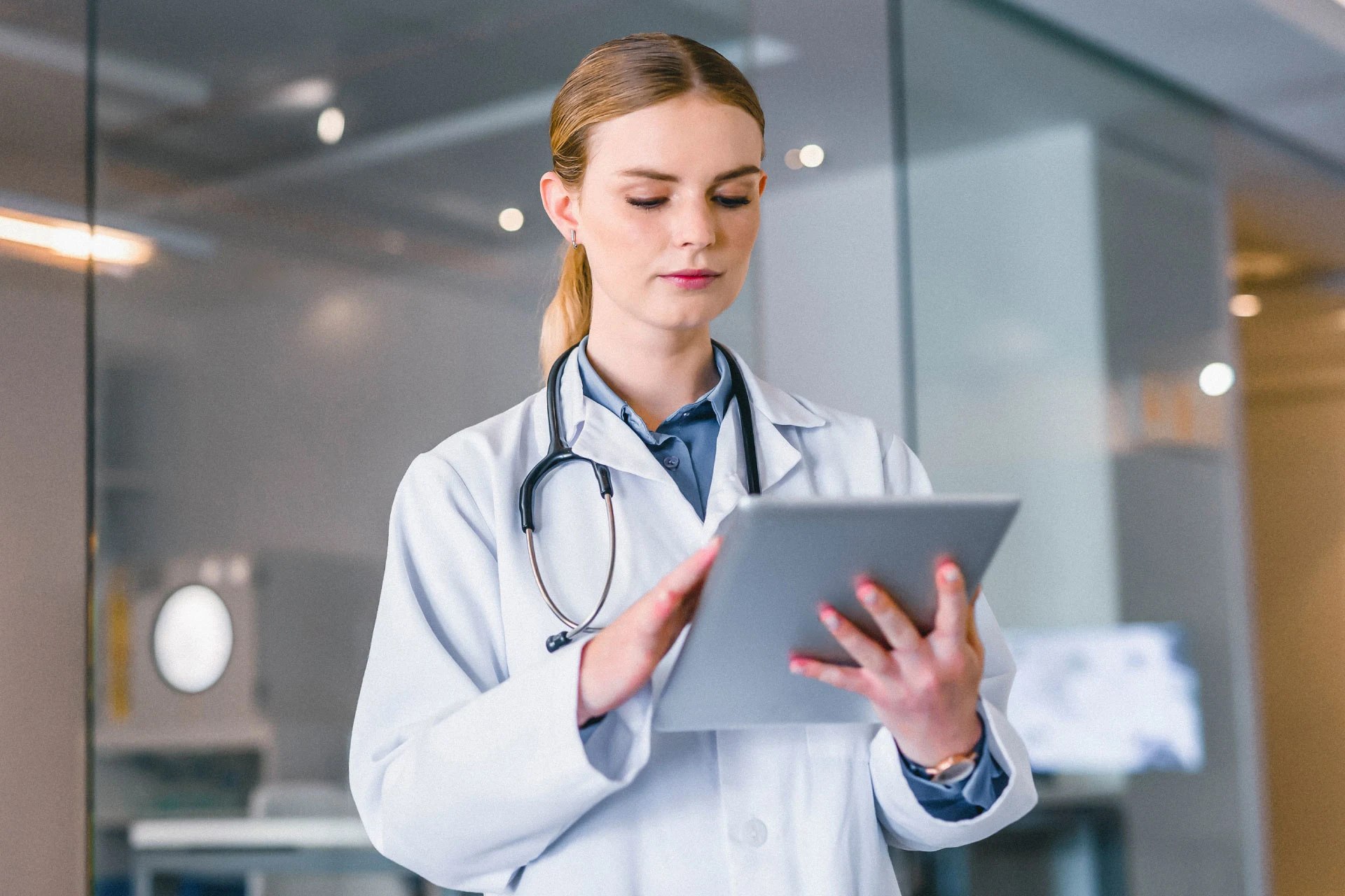 Medical professional holding a tablet in a healthcare environment