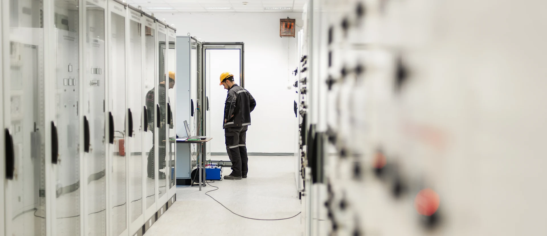 Technician inspecting equipment in a field services environment