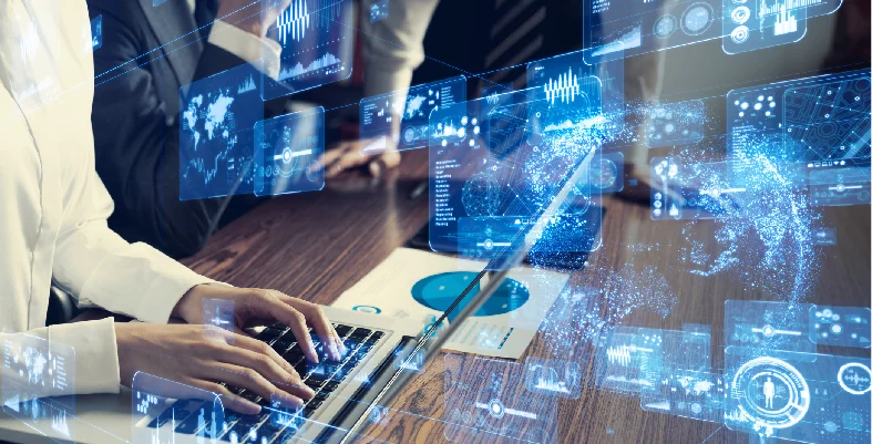Hands typing on laptop keyboard with overlapping digital analytics graphics