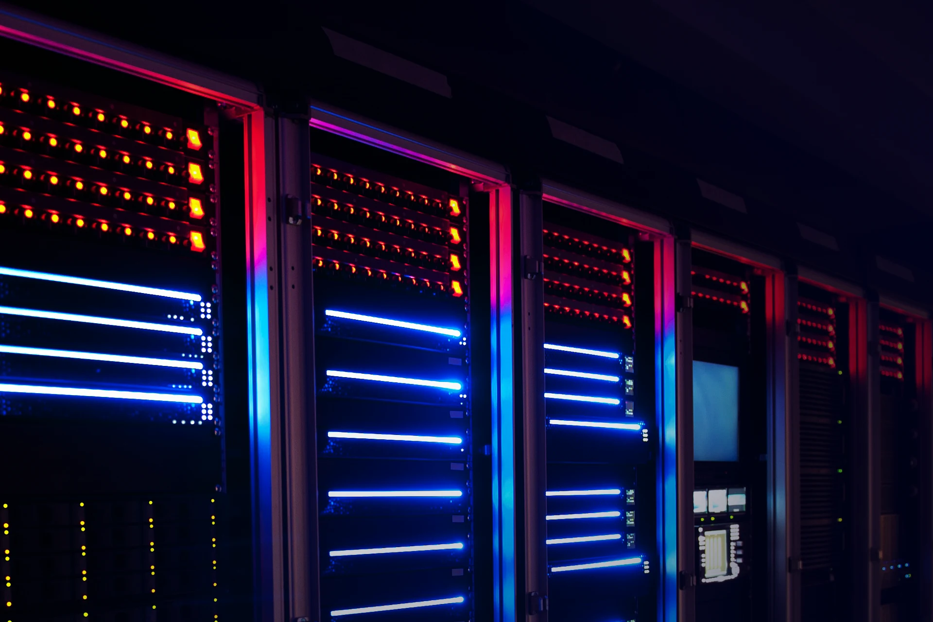 Rows of data servers with illuminated indicators for data analysis