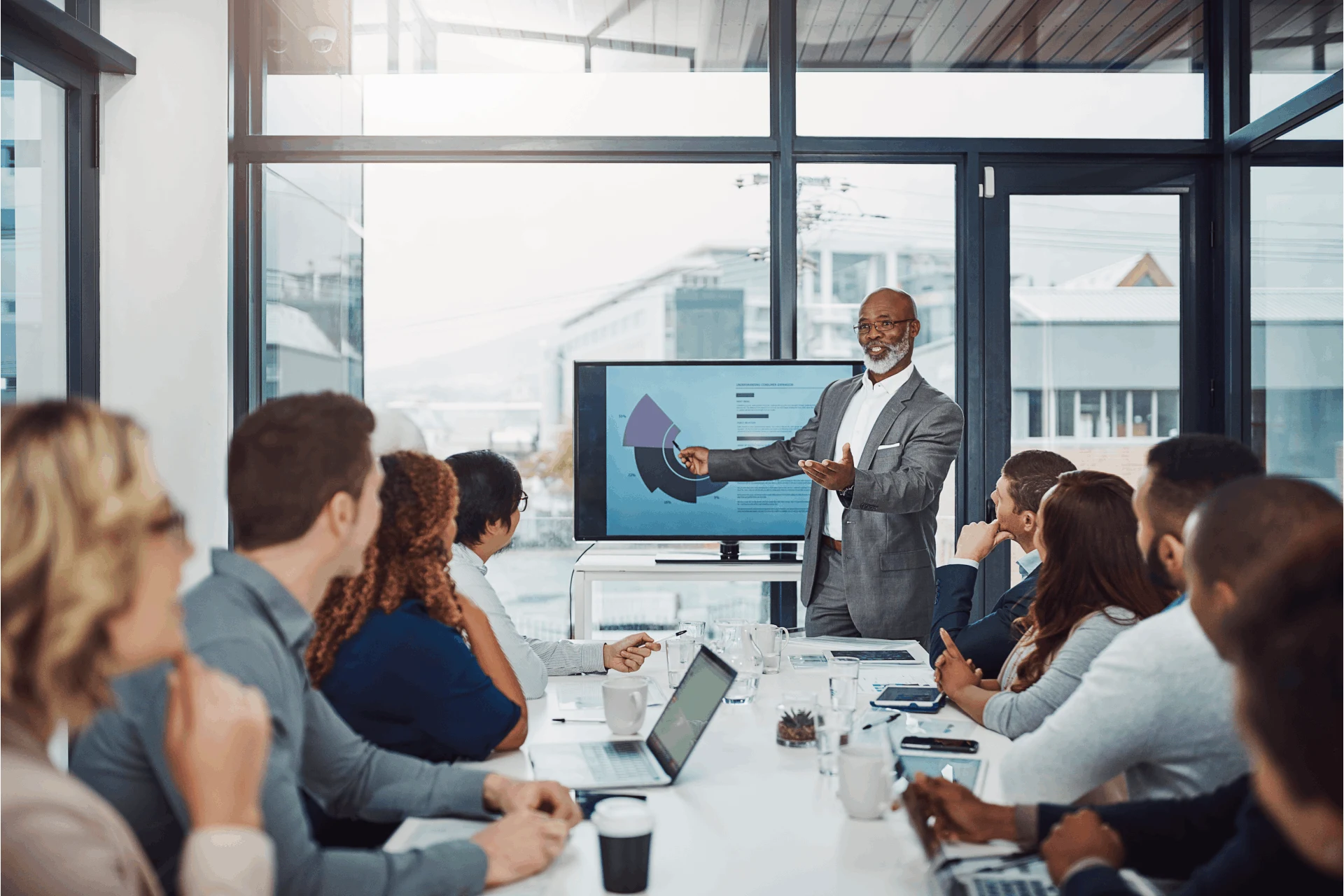Business leader presenting strategies for servitization in a meeting