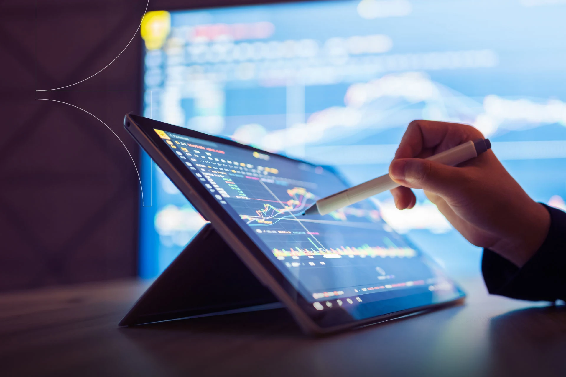 Person using a tablet with forex trading graphs during a financial analysis