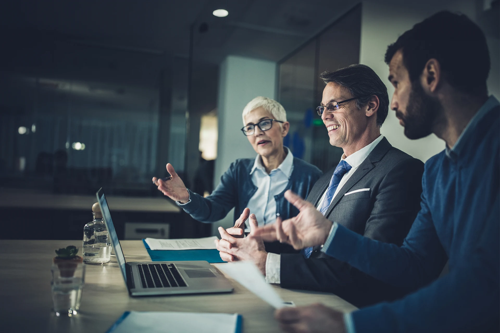 Professionals discussing strategies during a business meeting.