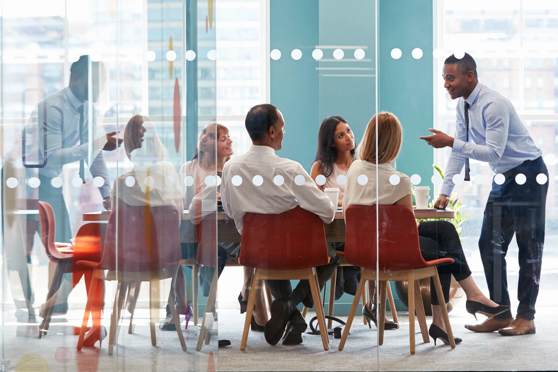 Business team engaged in discussion during a meeting in a conference room.