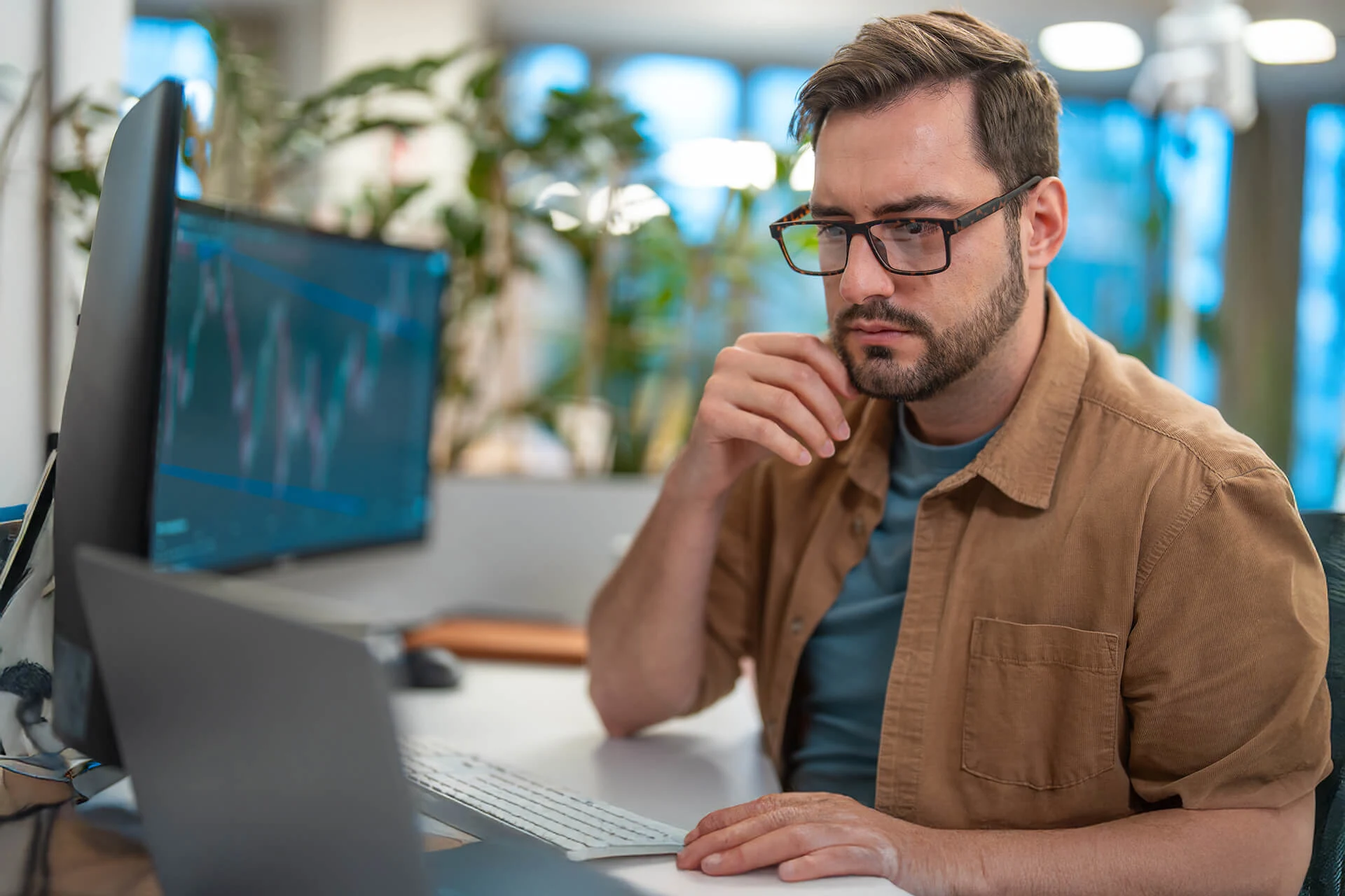 Professional analyzing data on a computer for operational efficiency