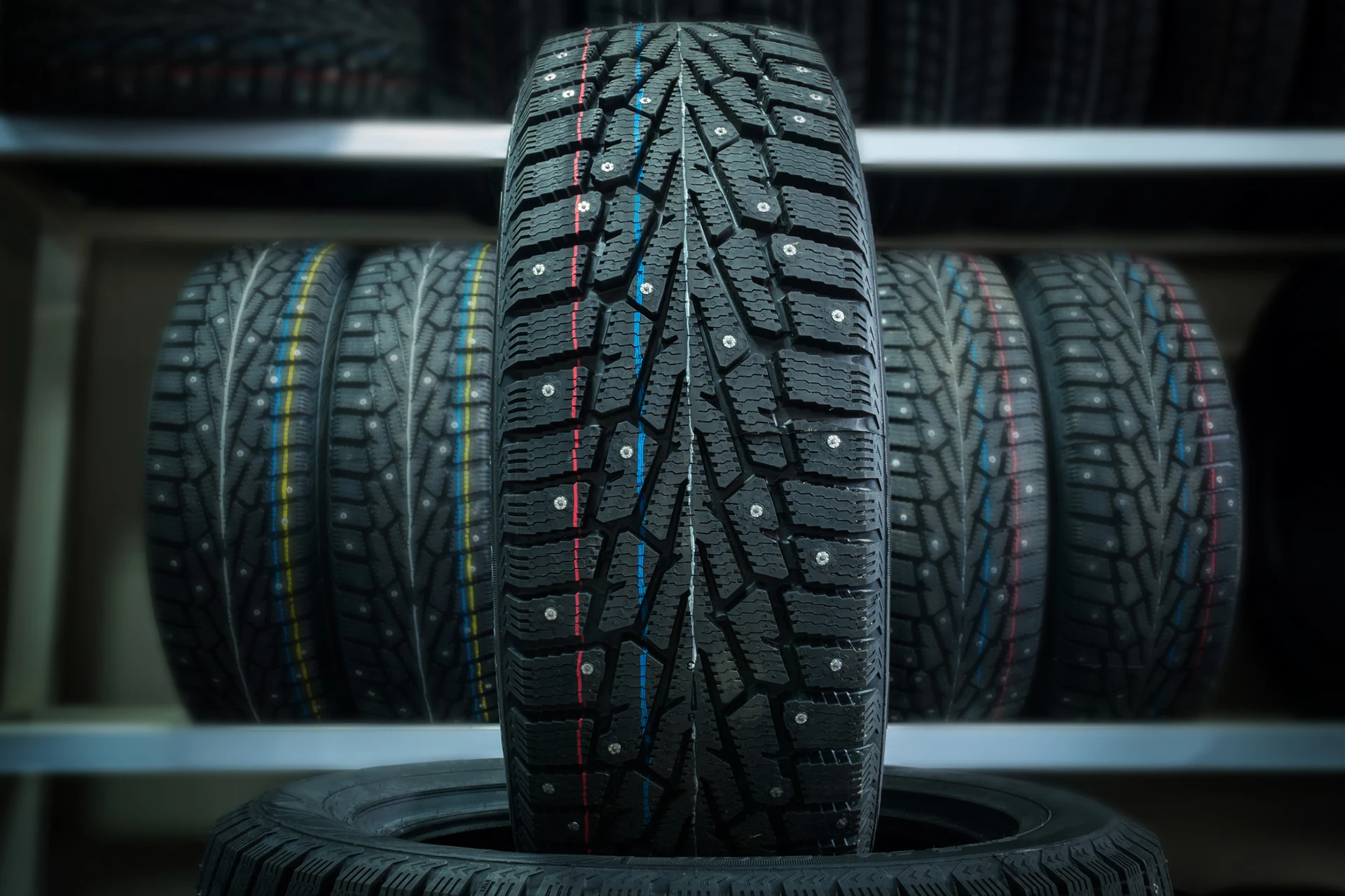 Showcasing a prominent tyre with multiple tyres in the background