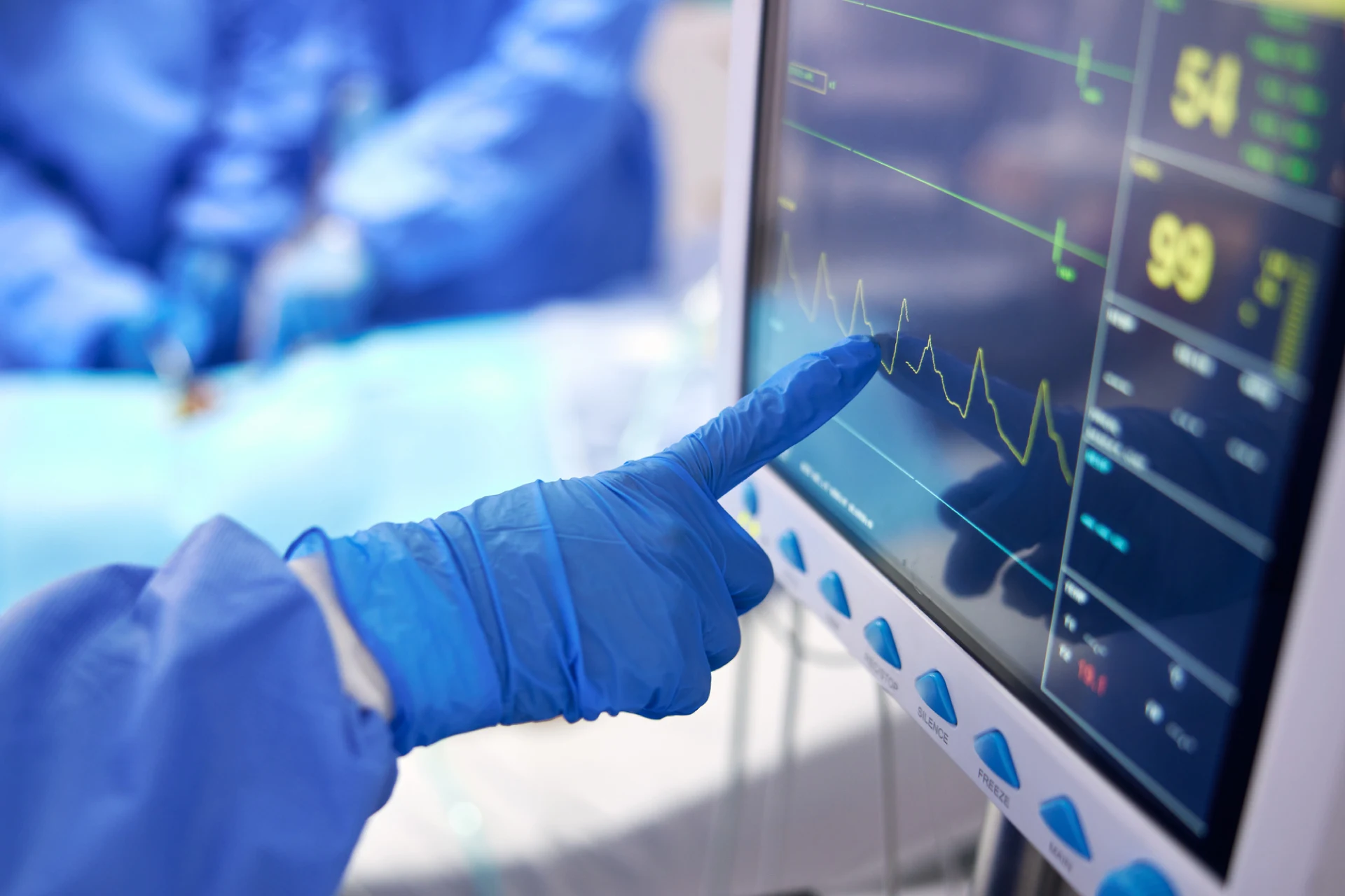 Healthcare professional monitoring patient data on a medical device