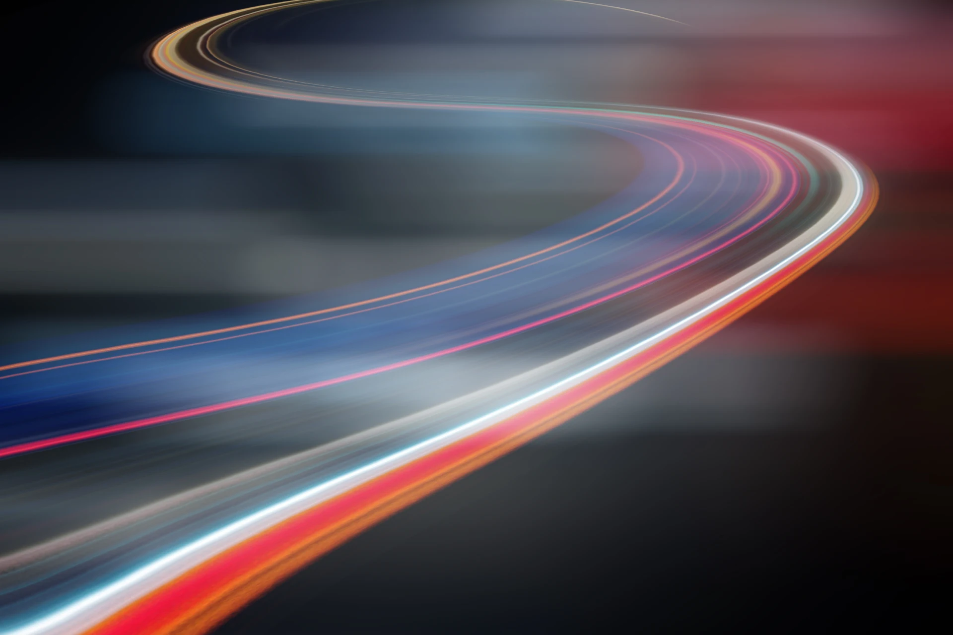 Curved light trails representing digital transformation for a Zensar newsroom article.