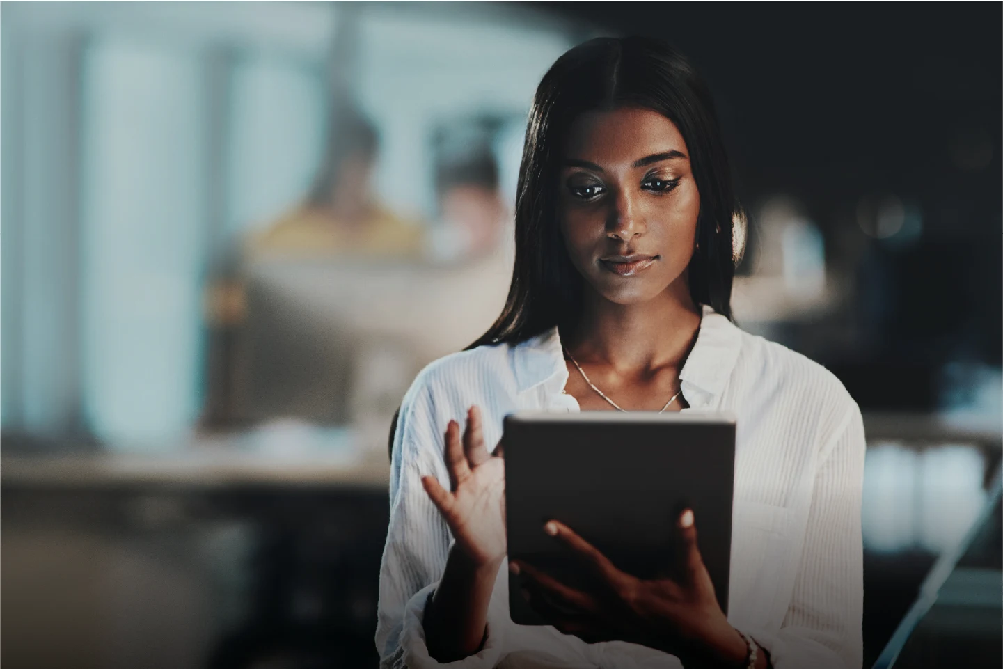 Woman using a tablet, emphasizing engagement in technology discussions