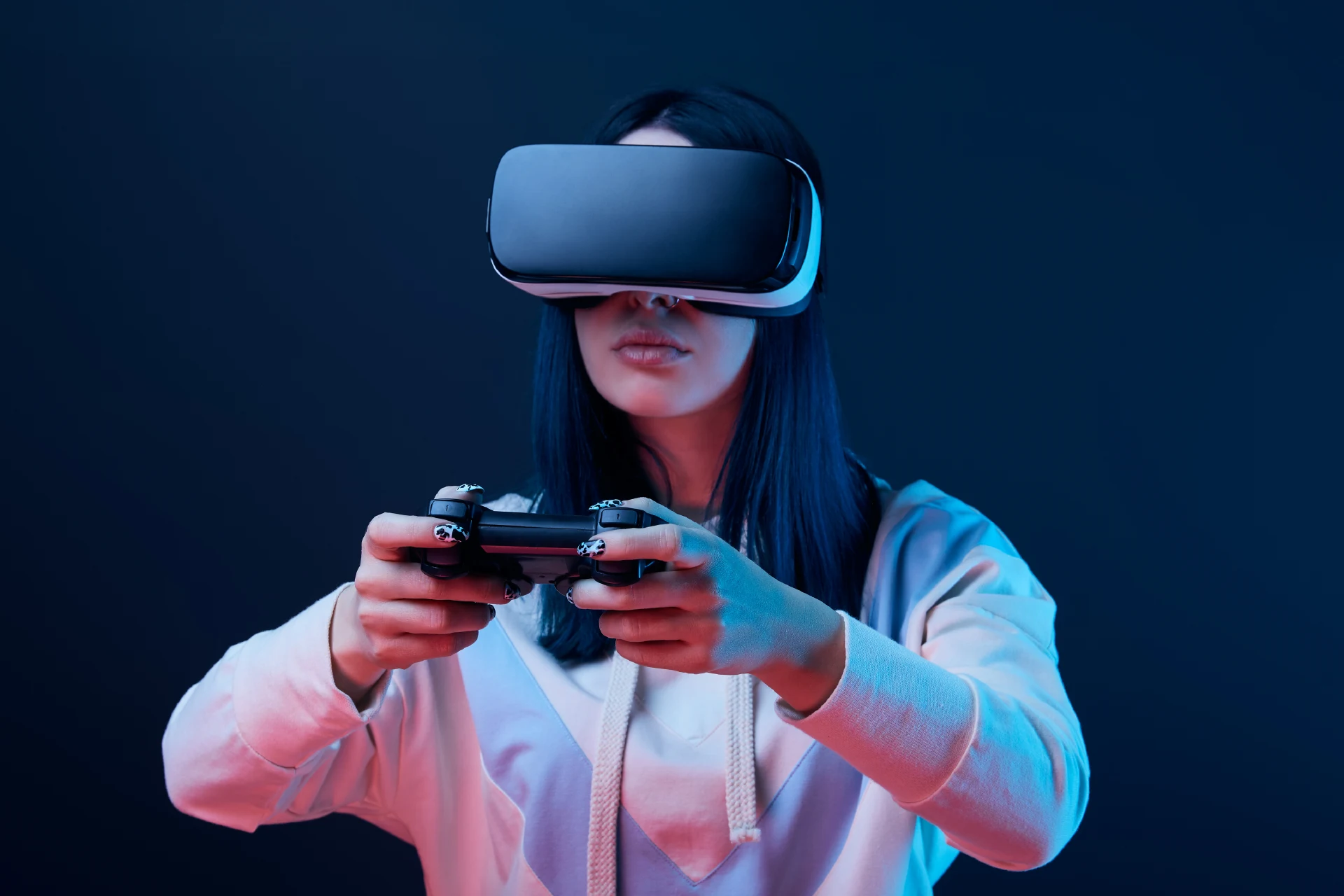 Person wearing a VR headset and holding a game controller