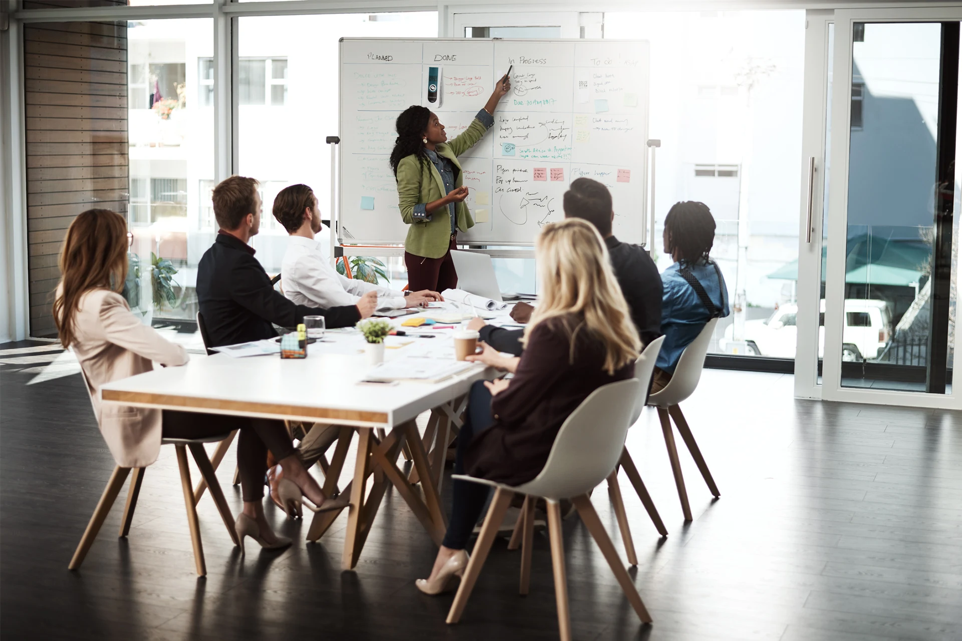 Team discussing cloud transformation strategy in a modern meeting room